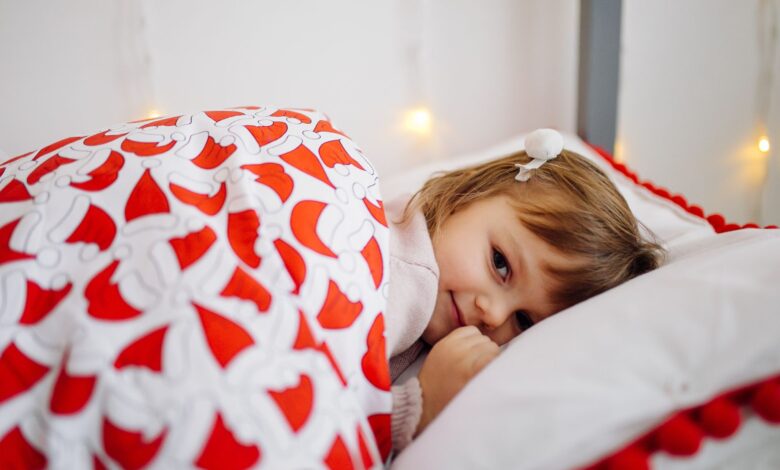 A kid laying in a thick duvet also helps you find best duvets deals on Christmas
