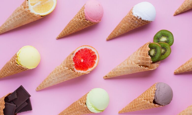 Various soft serve ice cream cones with a delightful mix of fruit and chocolate toppings