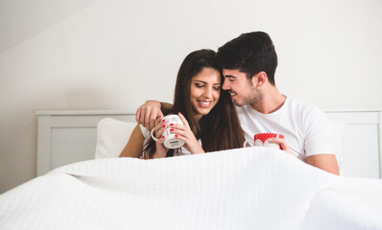 couple relaxing on comfortable bed