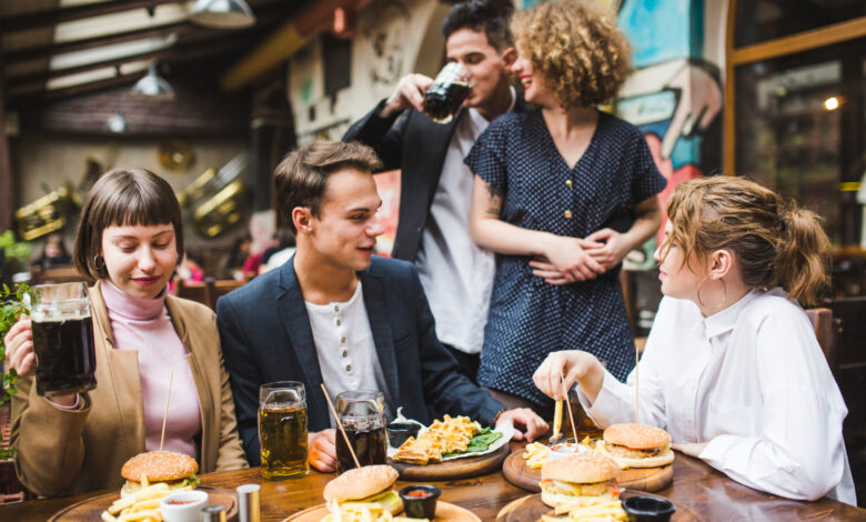 Adults enjoying delicious party food